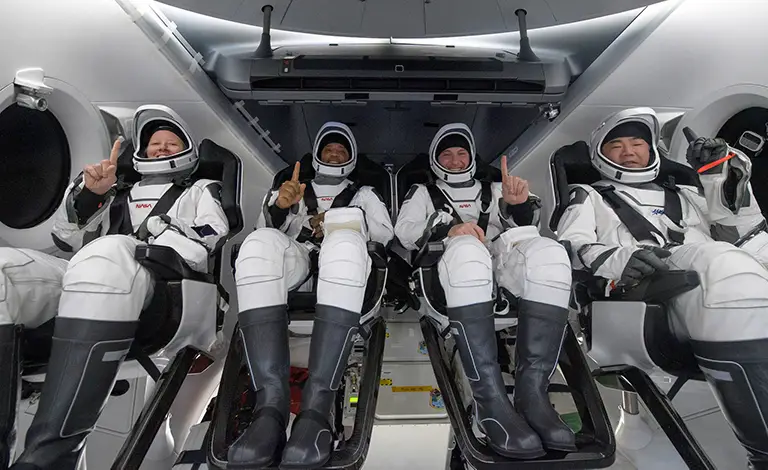 Crew Dragon brings four astronauts back to nighttime splashdown