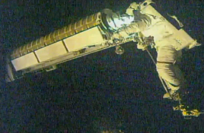 Spacewalking astronauts install second upgraded solar array