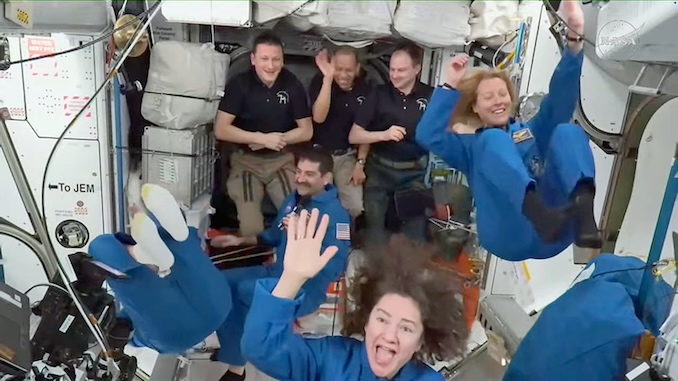 Replacement crew docks at space station, boosts crew back to seven