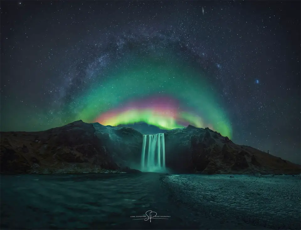 Rainbow Aurora over Icelandic Waterfall