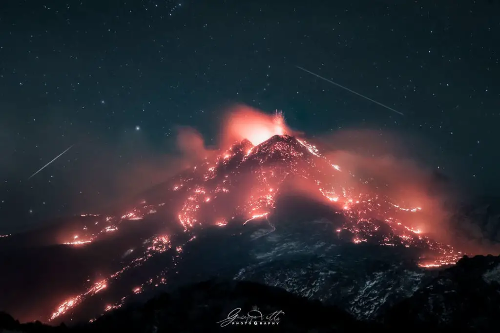 Stars over an Erupting Volcano