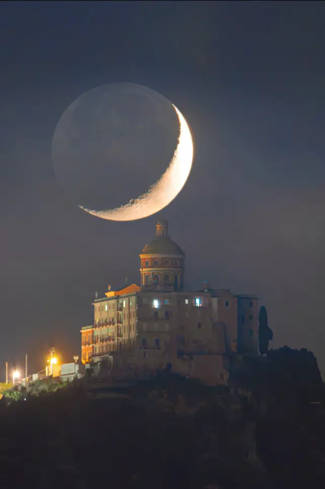 The Daily Telescope: A quarter Moon over Sicily reflects light from Earth